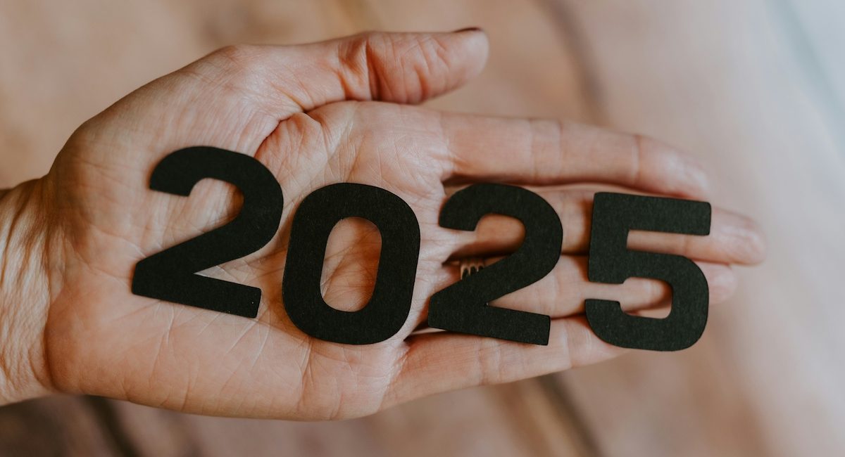 2025 NYE A hand holding 2025